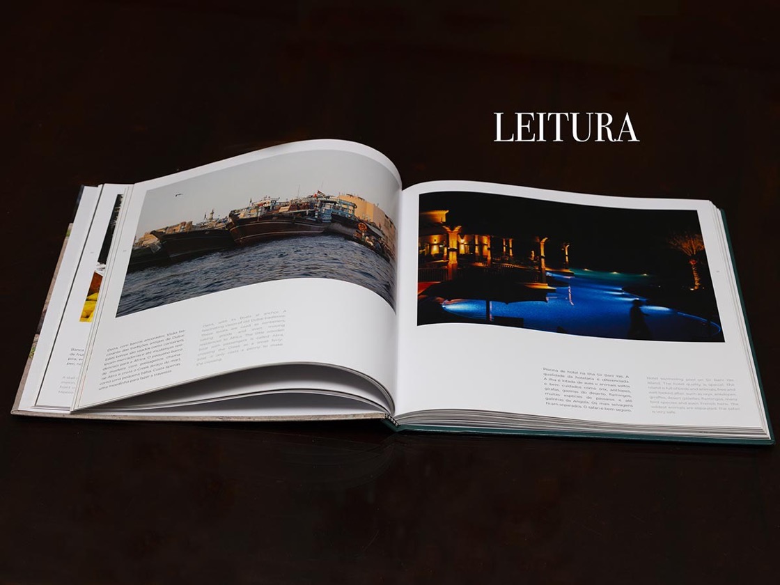 O livro Outras Culturas aberto, mostrando duas páginas de fotografia